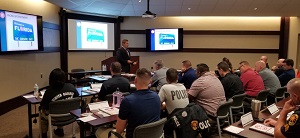 Image of police officers sitting in classroom learning Image of police officers sitting in classroom learning