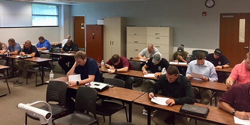 Picture of officers taking their end of training test