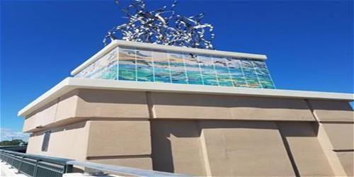 Tile mosaic and sculpture designed by Guy Harvey on towers at four corners of the bridge_Port St. Lucie Tile mosaic and sculpture designed by Guy Harvey on towers at four corners of the bridge_Port St. Lucie